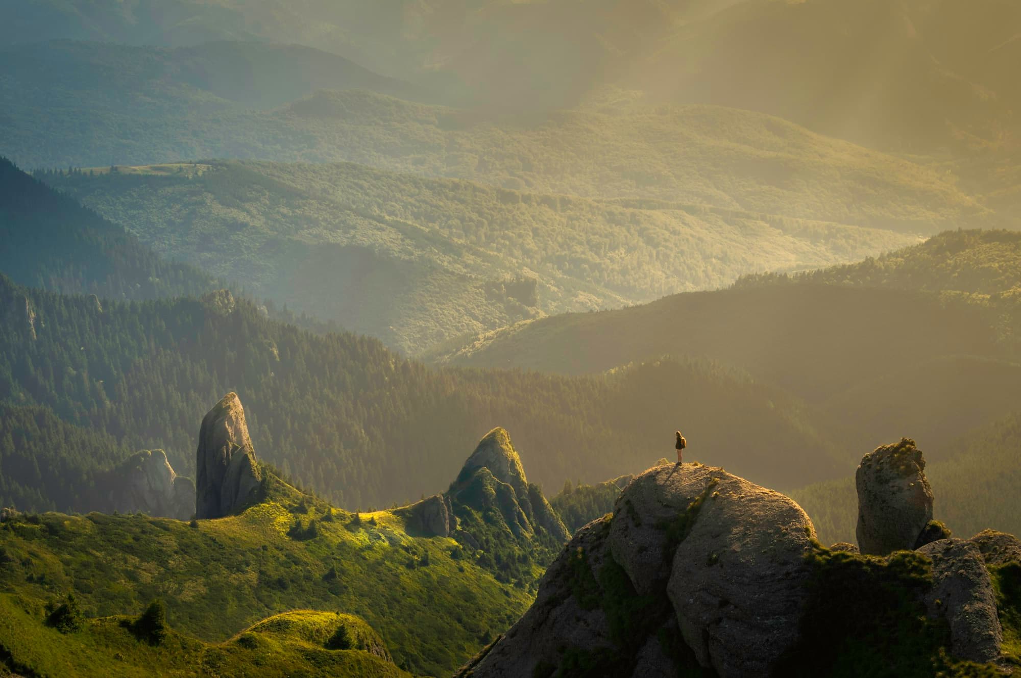 Sunlit green ridges and rock towers